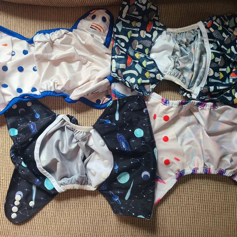 FOUR BAYRLI HEAVY WETTER CLOTH DIAPERS AND COVERS